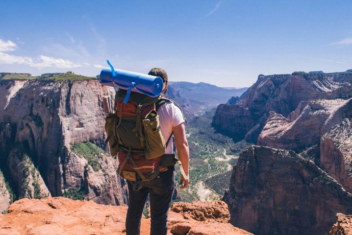 A man standing on top of Mount Zion National Park, United States