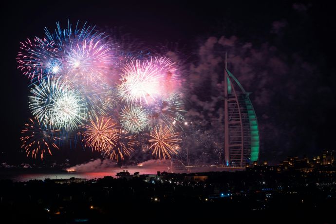 Fireworks display near Burj Al Arab building at nighttime