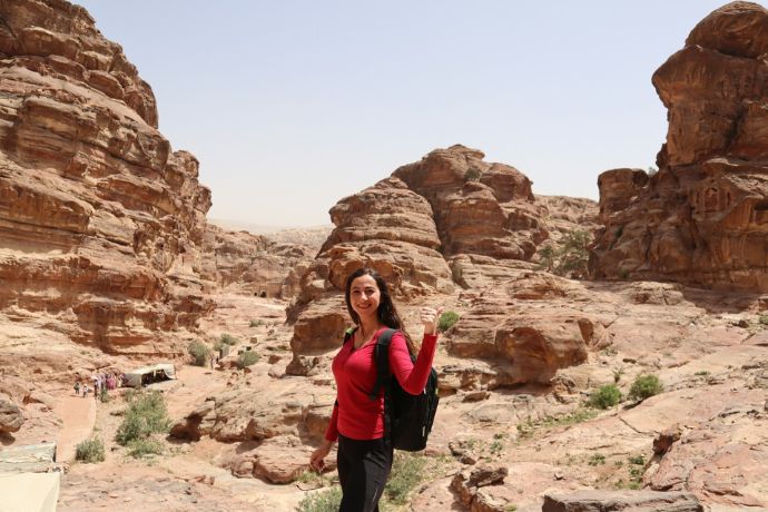 A woman standing in Saudi Arabia's the desert