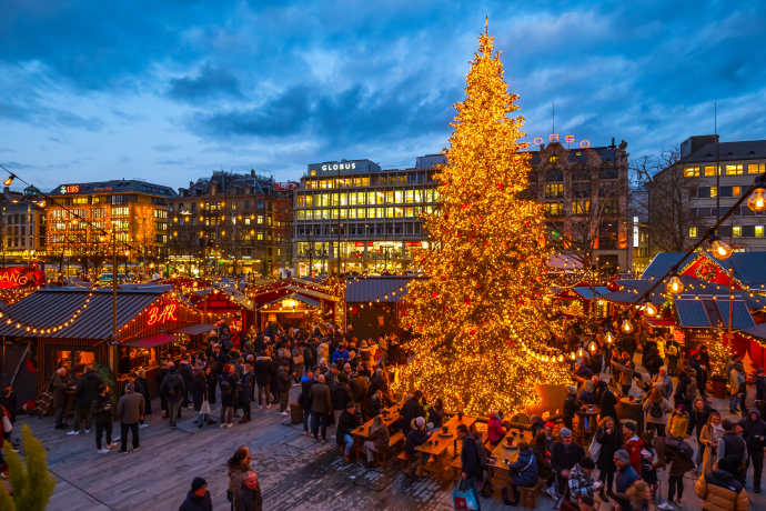 The first Christmas and New Year holiday activity is exploring the magical Christmas market at night with twinkling lights and wooden stalls. The first Christmas and New Year holiday activity is exploring the magical Christmas market at night with twinkling lights and wooden stalls.