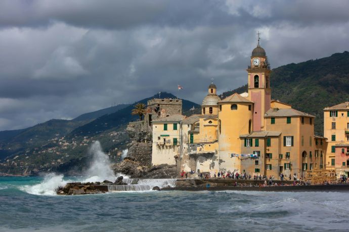 Seawave crashing at houses, Camogli, Italy