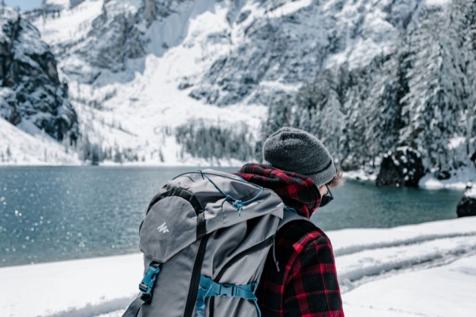 The man walking near the lake during winter, Lago di