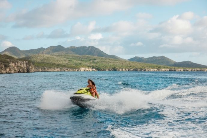 Woman riding a jet ski on the ocean