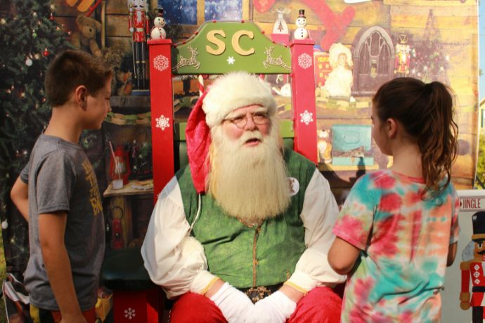 Young children meet Santa Claus